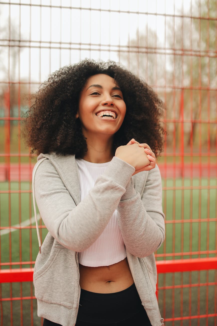 woman in gray jacket smiling